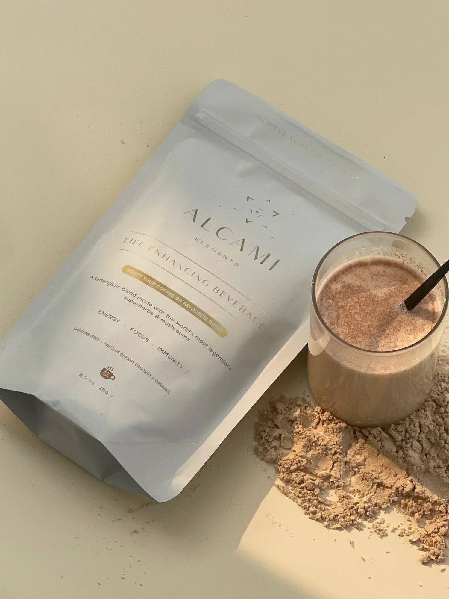 Product shot of the Life-Enhancing Blend from Alcami Elements mixed in milk.